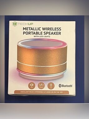 TechUp metallic pink portable
Bluetooth speaker with LED lights